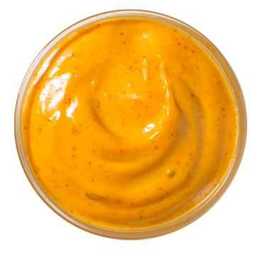 Creamy Jalapeno dipping sauce from Church's Texas Chicken, with a smooth texture and a hint of spice.